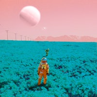 a man in an orange spacesuit standing in a field
